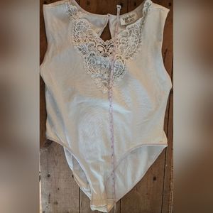 Victoria's Secret Ivory Sleeveless Bodysuit with Snaps